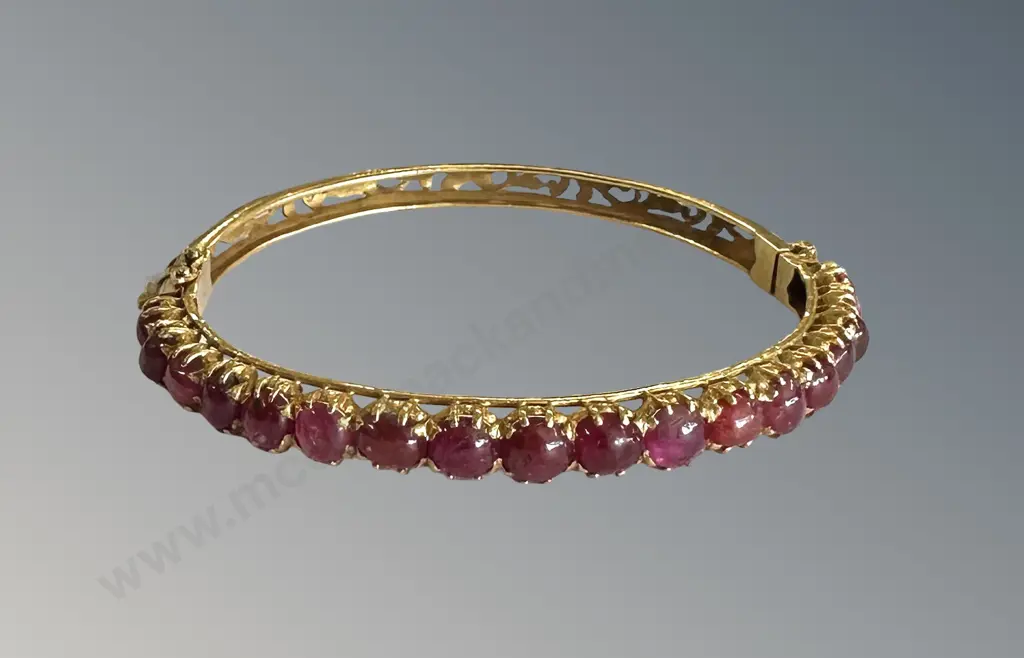 18ct Gold and Ruby Hinged Oval Snap Bangle, TW12.09gms, Valuation $4850 Image 1++